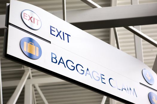 Baggage claim and exit sign in an airport