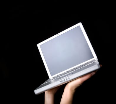 Laptop with blank screen - presented with a pair of hands