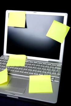 A sticky note on a laptop computer - remember this