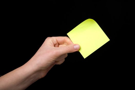 A blank sticky note stuck to a hand - remember this