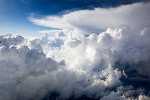 A dramatic cloudscape background with cumulus clouds