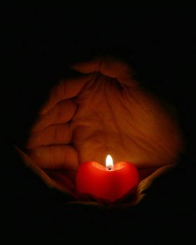 candle on a palm

