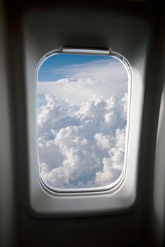 A view of clouds from an airplane window.