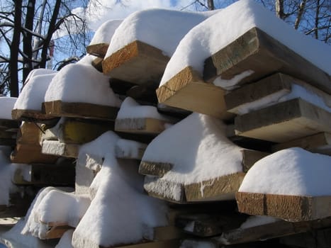 Set of logs with snow on them