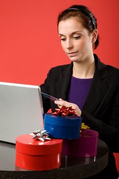 A young female shopping for christmas presents online.  