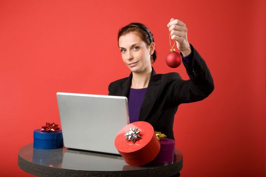 A young female shopping for christmas presents online. 