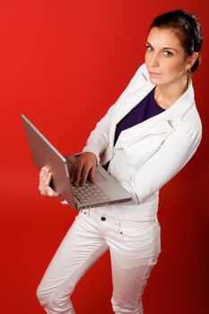 A young business woman or student using a laptop