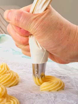 Baker making Choux pastry dough