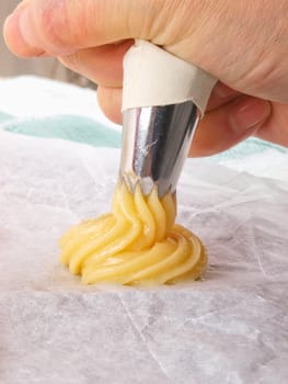 Baker making Choux pastry dough