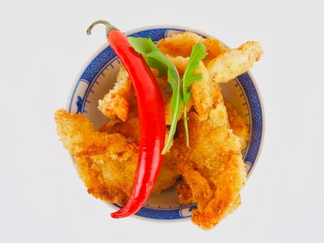 Baked shrimp in a bowl. close up on white background