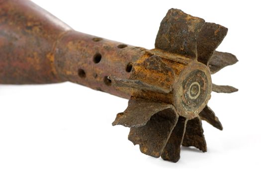 Old rusted World War II mortar shell isolated, selective focus