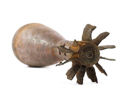 Old rusted World War II mortar shell isolated, selective focus