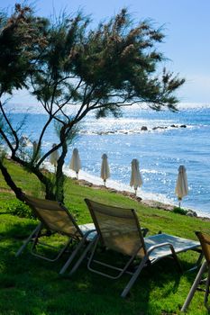 Lounge chairs on the beach at Greek hotel