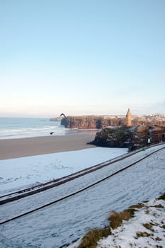 winters beach view of the castle overlooking the beach in ballybunion co kerry ireland
