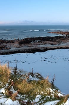 an empty rocky beach on a cold winters day