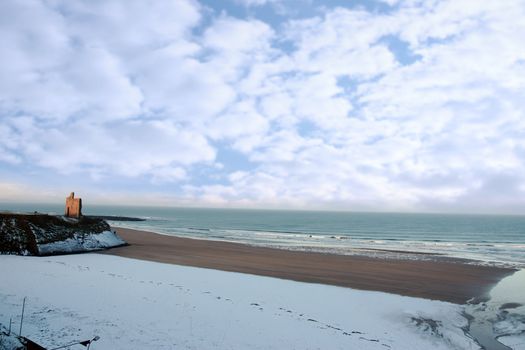 winters beach view of the castle overlooking the beach in ballybunion co kerry ireland