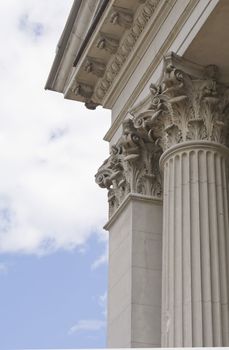 Detail of corinth columns on blue sky