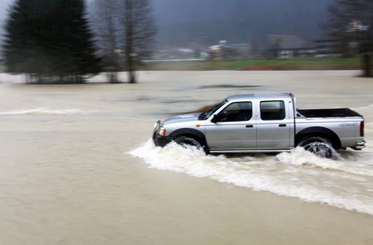car on flooded road