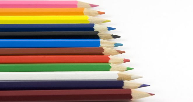 Collection of coloured pencils on white background
