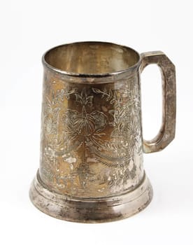 An old silver beer tankard. It is Eastern European  tankard decorated with ornament