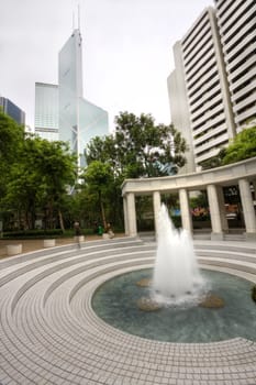 it is a fountain in front of modern building