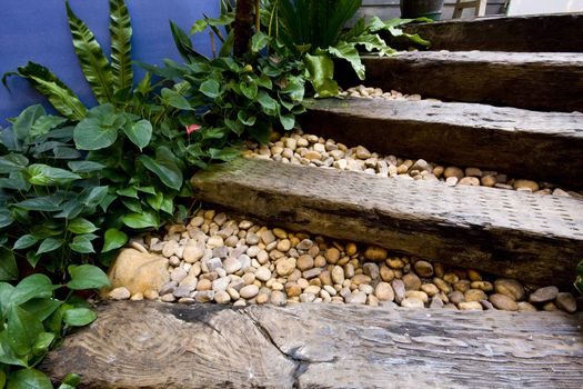 wood stair and some peeble stones