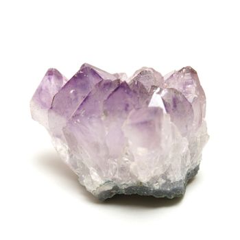 A closeup of a purple amethyst isolated on white.