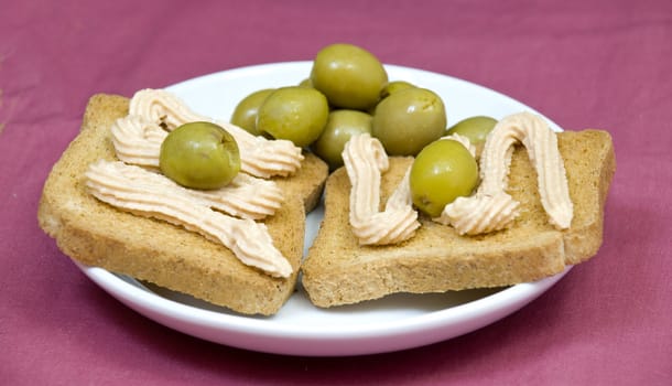 salmon pate canapes, on light purple background