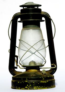 old antique oil lantern in white isolated