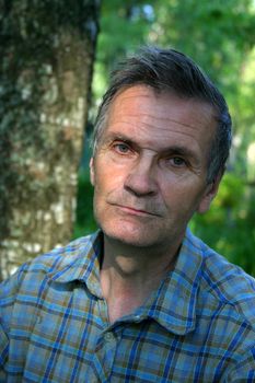 Senior man on a background of a forest