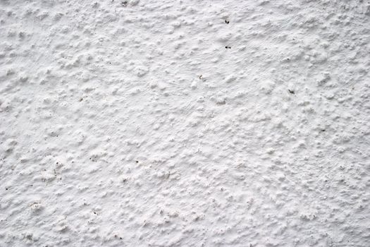 White plaster on an outside wall texture surface.