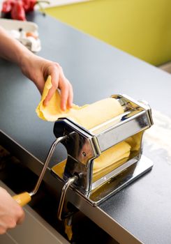 A detail - abstract image of a manual pasta machine