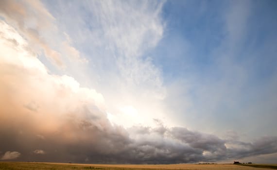 A group of storm clouds hovering above the horizon