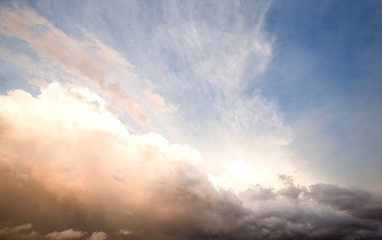 A group of storm clouds hovering above the horizon