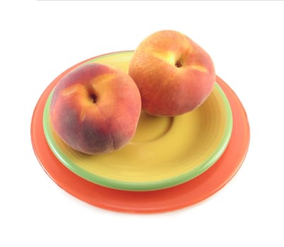 image of two peaches on a plate