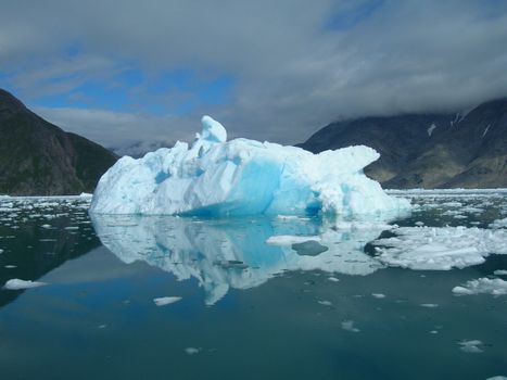 Iceberg floating in the sea at the coast of Greenland a beautiful summer day.