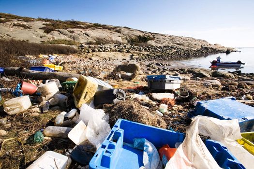 Garbage piled up on the coast of the ocean.