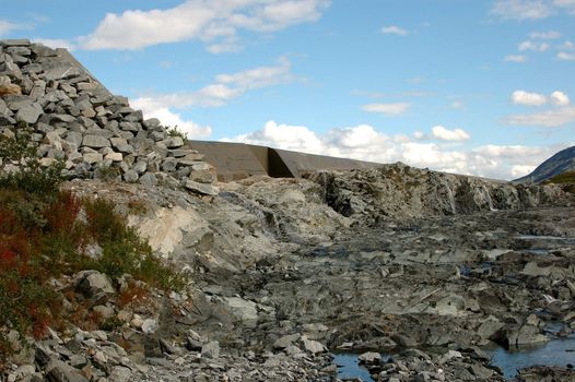 Dry river next to a dam