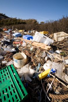 Garbage piled up on the coast of the ocean.