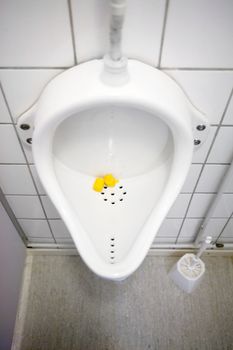 A close up of a public urinal