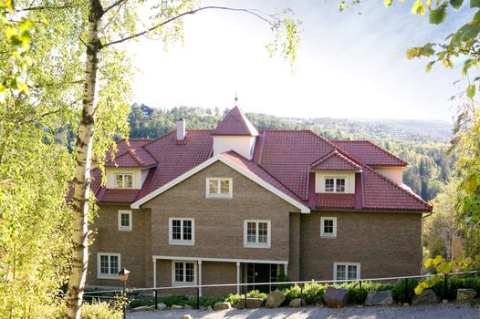 A large mansion overlooking the countryside