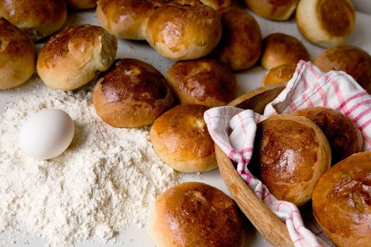 Close up detail of freshly baked hot cross buns in romantic renaissance lighting.