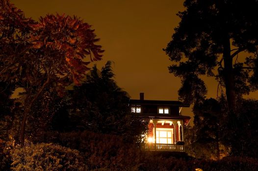 A house with spooky lighting, taken late at night.