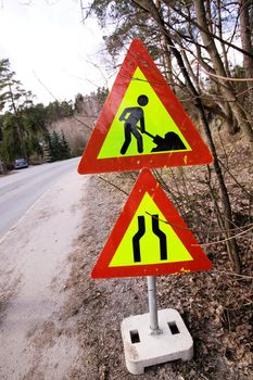 A construction sign on the side of the road.