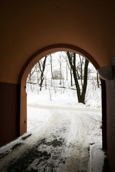 An arched driveway into a building