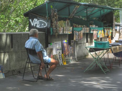 Parisian bookseller on the quays of the Seine river