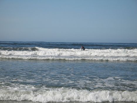 	
surfer on it's board in the ocean