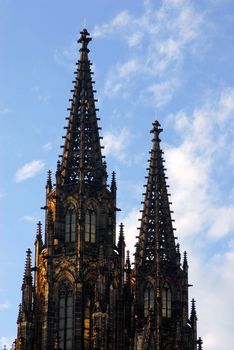 Gothic church towers in a blue sky. Prague.