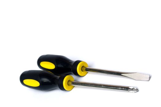 Yellow and black handled screwdrivers on white background