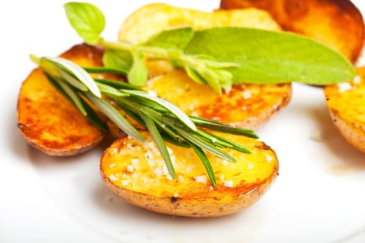 fried potato with a rosemary leaf